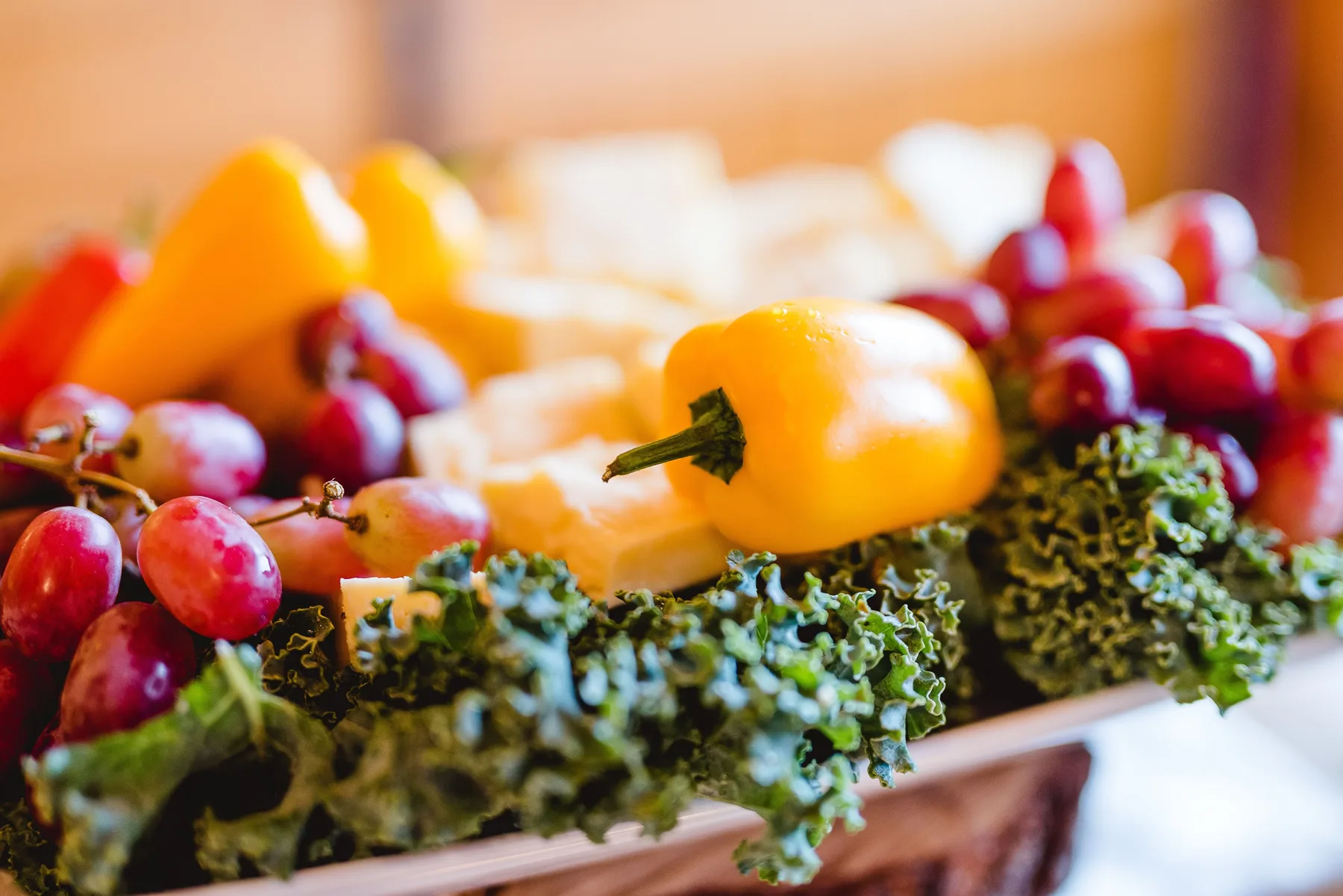 Fresh fruit and vegetables displayed at a catered gathering