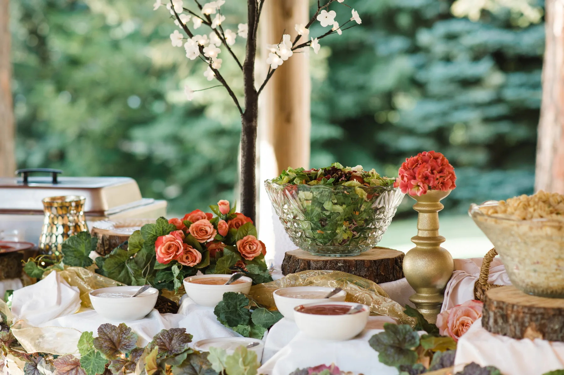 A beautifully set buffet surrounded by Montana greenery